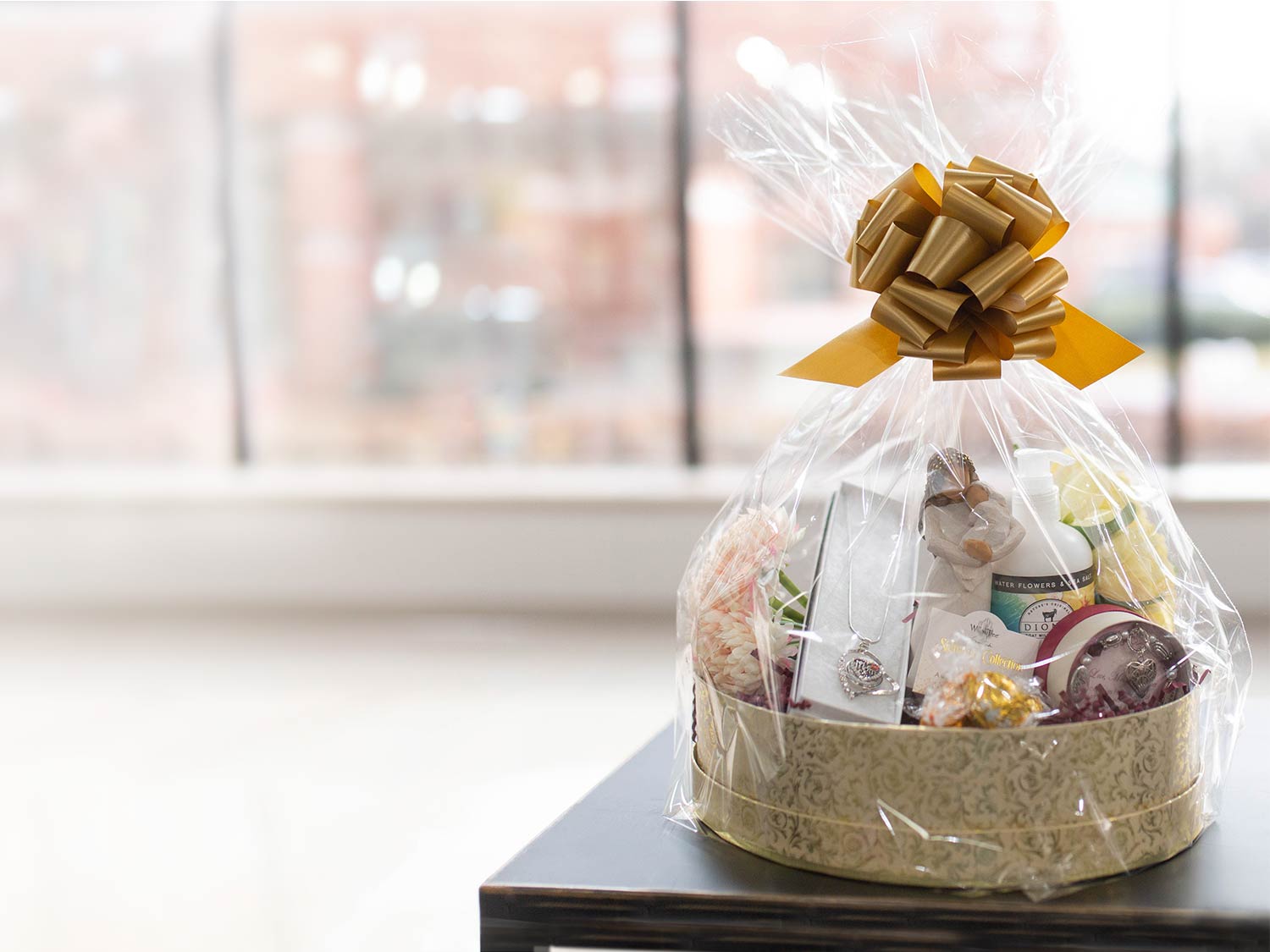 Gift basket with golden bow and personal care items